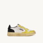 mulheres tênis cano baixo super vintage em couro branco preto e amarelo Autry 86XF202